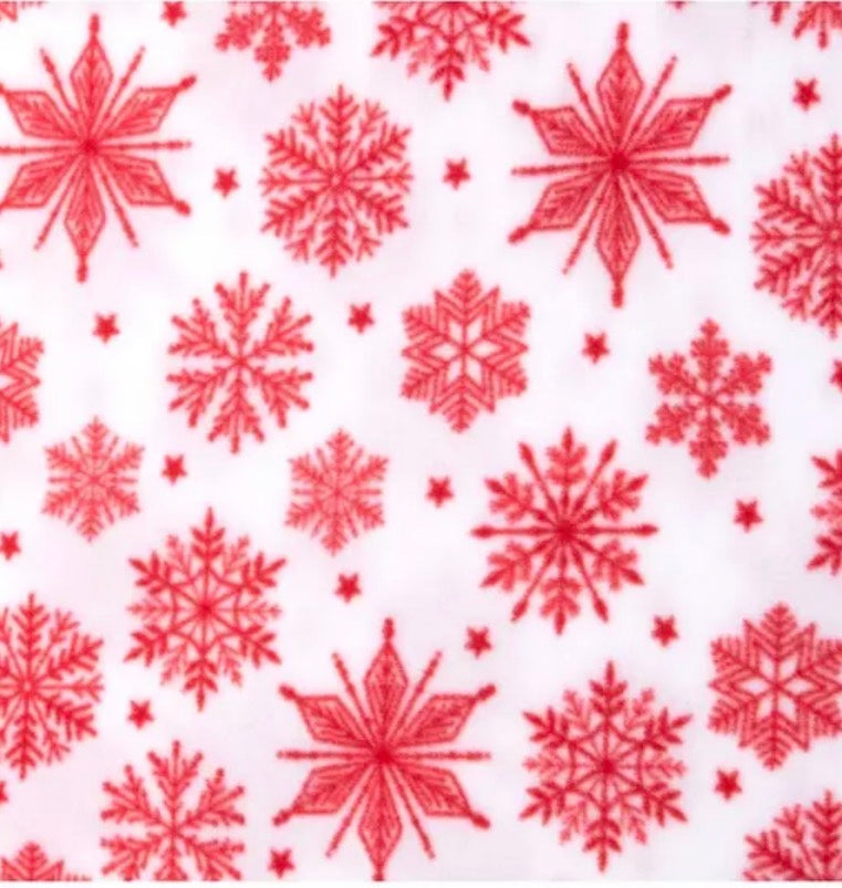 White holiday fleece with red snowflakes for a handmade 7T Designs Sherpa-lined dog jacket.